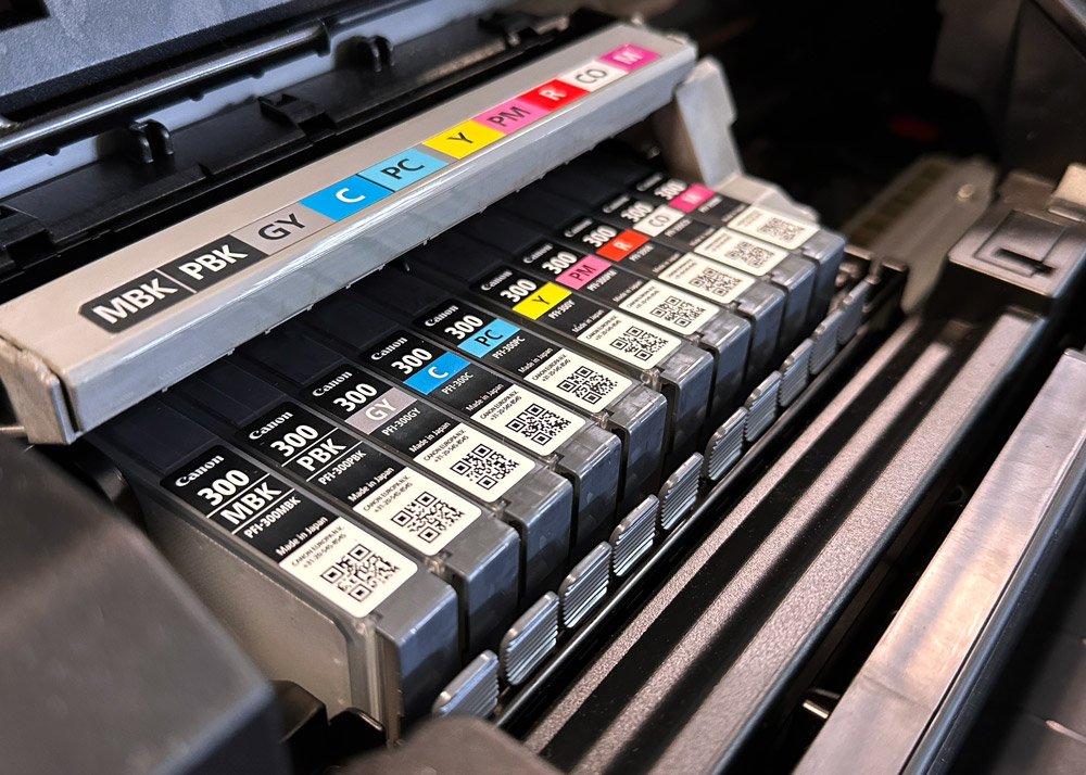 A close up of the ink cartridges in a Canon PRO-300 printer