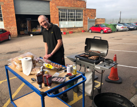 Simon in charge of the Friday morning breakfast BBQ