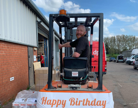 Simon driving his beloved forklift