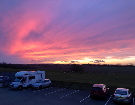 Beautiful image of the sun setting across the Stratford countryside